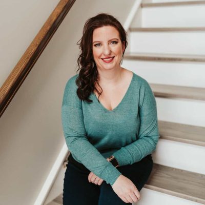Monica Froese sitting on stairs